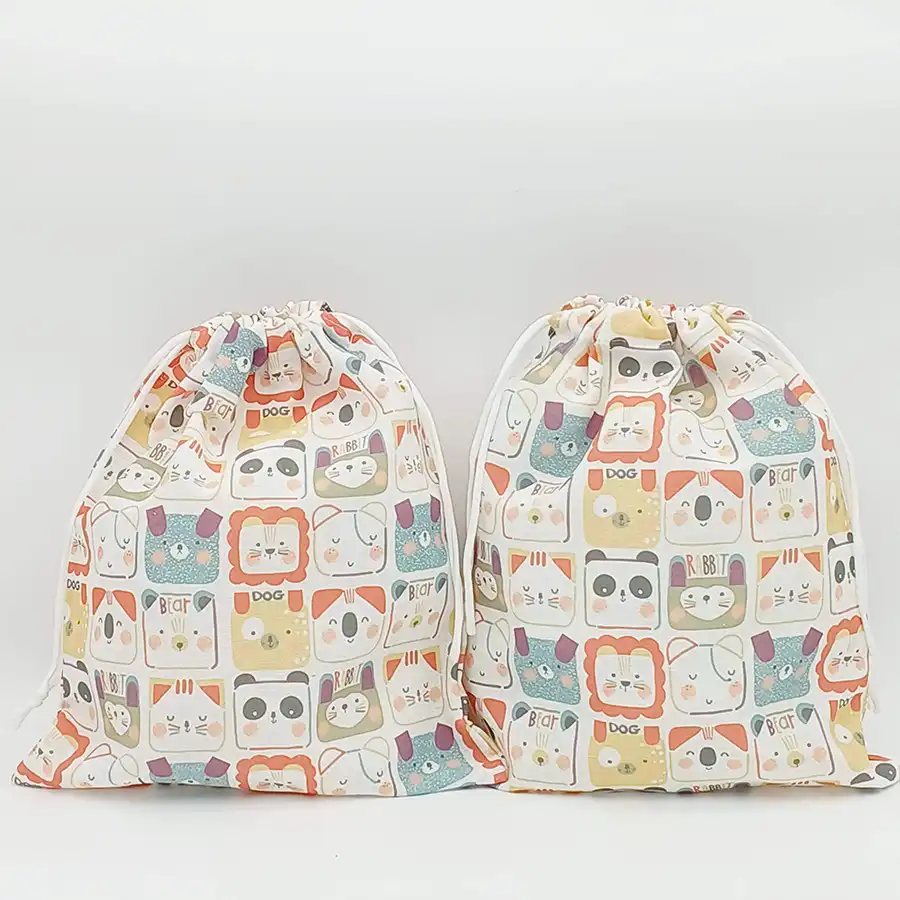 Pack de dos bolsas de tela con cordón y estampado de caras de animales