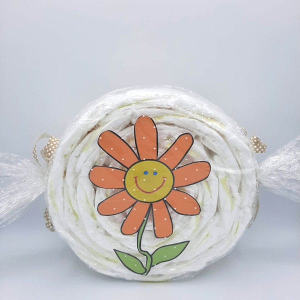 Caramelo de pañales con flor naranja sonriente
