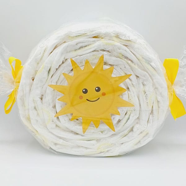 Caramelo de pañales con sol sonriente amarillo