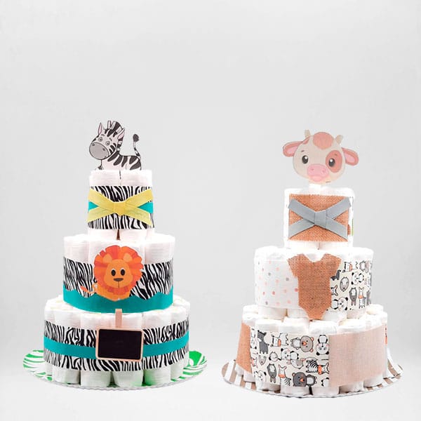 Dos tartas de pañales para gemelos y mellizos con cebra, león y vaquita